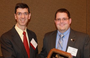 Patrick Mainieri (right) accepts the 2013 Outstanding Young Music Educator of the Year Award from Christopher Selby, President of the South Carolina Music Educators Association.  