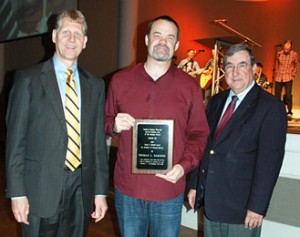 Southern Wesleyan University President Todd Voss, left, and Religion Professor Bob Black, right, presented Rev. Tom Harding with the Virgil A. Mitchell Excellence in Pastoral Ministry award during Trustees chapel April 10 at the university’s campus in Central. Harding is senior pastor of ALIVE Wesleyan Church in Central. 