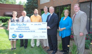 Sabrina House Children’s Charity — Representatives of Blue Ridge Fest, WYFF 4 and Andrew Pickens Designs, sponsors of Blue Ridge Fest, present a check for $14,000 to Sabrina House Children’s Charity. Pictured, from left, are Tina House and Billy House, parents of Sabrina House; Tony Kelley, Blue Ridge Electric Cooperative; Andy Pickens, Andrew Pickens Design; John Cessarich, Meteorologist, WYFF 4; Carol Goldsmith, News Anchor, WYFF 4; and John Soapes, General Manager, WYFF 4. 