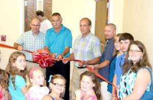 East Pickens Baptist Church held the formal ribbon cutting of Kid City last Sunday. Shown are The Rev. Jamie Duncan, Building Team Chairman Jeff Wood, Deacon Team Don Webb, the Rev. Bobby Craig, and KidCity Planning Team Members Heather Craig and Debra Graybeal, along with many smiling children from the church.