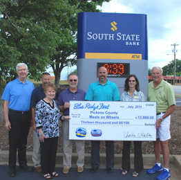 Pickens County Meals on Wheels Blue Ridge Electric Co-op employees David Collins, Tony Kelley and Ann Garren present a Blue Ridge Fest check for $13,000 to Pickens County Meals on Wheels. Accepting the check are Executive Director Meta Bowers and Sam Wyche, board member. Also on hand for the presentation are Fest corporate sponsors Tommy Bearden, owner of Bearden Landscaping and Bart Turner, vice president of South State Bank.