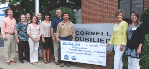 Samaritan Health Clinic From left, Blue Ridge Fest corporate sponsors Paul Gaughf, senior vice president of operations for Sumter Utilities, Judy Gillespie, personnel manager, Daniel Brazinski, manufacturing manager, Teresa Owens, corporate human resources manager, all of Cornell Dubilier, Spencer Dalton, owner of Solid Gold and Blue Ridge Electric Cooperative board director, join Blue Ridge Electric employees Michelle Watson, Tim Mays and Mark McCall present a $13,000 Blue Ridge Fest check to Samaritan Health Clinic of Pickens County. Accepting on behalf of Samaritan Health Clinic are Assistant Director, Nicki Dunn and Development Director, Griffin Hill. 