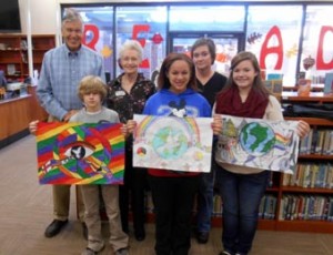 Each year, Lions clubs around the world proudly sponsor the Lions International Peace Poster Contest in local schools and youth groups. This art contest for kids encourages young people worldwide to express their visions of peace. For more than 25 years, millions of children from nearly 100 countries have participated in the contest.  The theme of the 2014-15 Peace Poster Contest was "Peace, Love and Understanding." Students ages 11, 12 and 13 were eligible to participate, and over 100 Liberty Middle School art students participated in this contest under the direction of Art Teacher Elaine Snell. This year’s Liberty Middle School Peace Poster Contest winners are 7th grader Jay Bost (3rd Place), 8th grader Brittany Price (2nd Place), and 8th grader Audrey King (1st Place). Pictured above are Jay Bost, Brittany Price, Audrey King.  Back row: Liberty Lions Club Peace Poster Contest Chairman Oscar Thorsland, Liberty Lions Club President Jean Thomas, and Liberty Middle School Art Teacher Elaine Snell. The Liberty Lions Club monthly breakfast meeting is held on the secound Thursday at 7 a.m. at Little Bistro Restaurant For more information call Jean Thomas at 843-4204 or go to the Lions International website at www.lionsclub.org. 