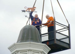 Pictured above, Hamp Summey and Bill Evatt go up on a crane to change the Hillcrest Memorial Park weather vane to represent the Clemson Tigers.