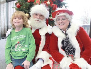 Colin Gilstrap of Pickens poses with Santa and Mrs. Claus at the World of Energy.