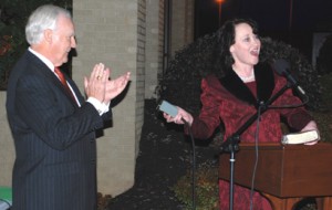 Darleen Sutton, right, lights the tree as Blue Ridge CEO Charles Dalton