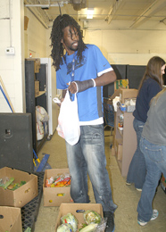 Dwayne Bryant of Brunswick, Ga., sorts through produce at Golden Harvest Food Pantry during a recent day of service involving 200 Southern Wesleyan University students. Southern Wesleyan was recognized for its students’ many hours of service to the community by being awarded a place on the President’s Higher Education Community Service Honor Roll.
