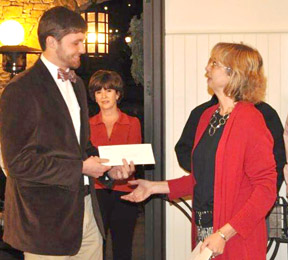 Parenting Place media and marketing director Mitchel Jayne and The Reserve at Lake Keowee’s Community and Charitable Foundation executive director Kathryn Gravely are pictured during recent check presentations. 