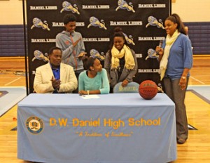 Rex Brown/Courtesy The Journal Daniel High School senior Taylour Hunter looks at her mother and girls’ basketball coach, Cosandar Griffin, while surrounded by family during Hunter’s signing on Wednesday at the school in Central.