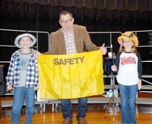 Pickens Elementary students Joshua Jackson and Mary Kate Fain participate in a magic trick with the help of magician Scott Davis, representing Blue Ridge Electric Co-op.