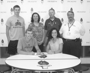 Pickens’ Tanner Saunders is shown signing with USC-Upstate recently. Pictured with him are Dalton Yates, Tammy Saunders, Bobby Ravencraft, Max Monroe and Somer Anthony.