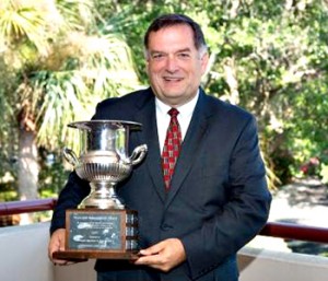 Six Mile Town Council member James Atkinson is pictured with the award the town was recently presented by the South Carolina Municipal Association for its efforts in securing Our Bank. 