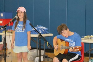 Maria and Kevin Blakeney rehearse for the talent show during the seventh annual TAM YAM camp. 