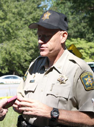 Pickens County Sheriff's Department Chief Deputy Creed Hashe briefs reporters following shooting death of two people in Pickens on Monday.