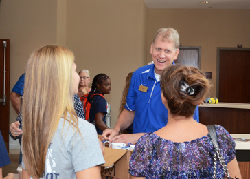 Southern Wesleyan University president Todd Voss greets students and their families during orientation Aug. 15 at the Central campus. Going into the 2015-’16 academic year, enrollment has seen a significant increase over last year.