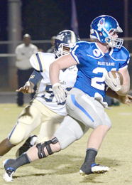 Tommy McGaha/seeyourphotohere.com Pickens senior Gunner Covey gets past a Seneca defender during the Blue Flame’s loss to the Bobcats on Oct. 9. Pickens will travel to Seneca’s Tom Bass Field for the two teams’ playoff opener on Friday night.