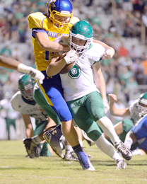 Tommy McGaha/Courier Easley’s Will Drawdy tries to shrug off a Wren tackler during their game Sept. 11