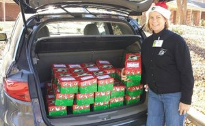 Carol Avery helps load shoeboxes for Operation Christmas Child.