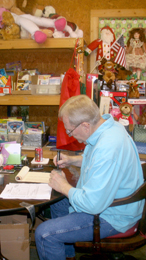 Ben Robinson/Courier Country Santa organizer Buddy Cox works at his Pumpkintown home on Saturday. Cox has been helping the less fortunate in the Upstate through Country Santa for more than 30 years.