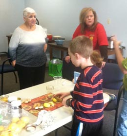 Kristy Williams demonstrates making lemon-ginger honey.