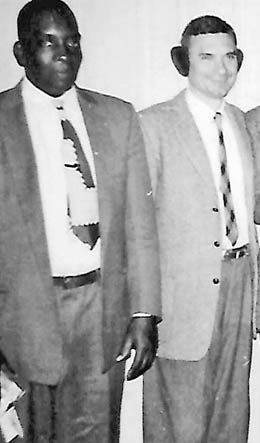 Photo courtesy Dr. Thomas Cloer III Floyd Roberts, left, with Albert Harrison, president of Ellijay Telephone Co., at a Christmas social in the 1950s.