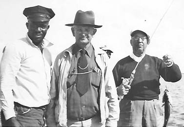 Photo courtesy Dr. Thomas Cloer III Chauffeur Arnold, W.T. Cloer and Nat Gennett are pictured fishing in Florida in the 1950s.