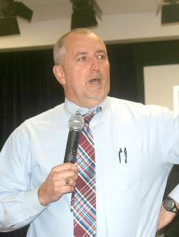 Ben Robinson/Courier School District of Pickens County superintendent Danny Merck speaks at a community meeting at Holly Springs Elementary School last week.