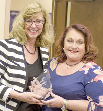 Anne Fulcher, right, received the Provost’s Community Leadership Award April 28 at Southern Wesleyan University in Central. Dr. Tonya Strickland, Southern Wesleyan’s provost, presented Fulcher with the award. 
