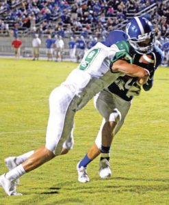 Kerry Gilstrap/Courier Easley safety Sean-Thomas Faulkner dislodges the ball from the arms of Pickens’ Robert Jones with a jarring hit in the end zone during their game Friday night.