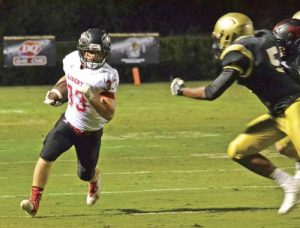 Brandy Karr/Photo Liberty’s Shaun Karr gets to the edge during the Red Devils’ 7-6 season-opening road win over Pendleton on Friday night.