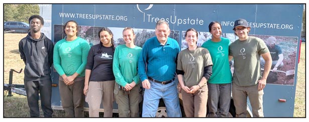 Volunteers plant trees in Six Mile