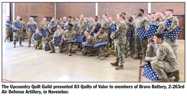 Guild presents quilts to Bravo Battery troops